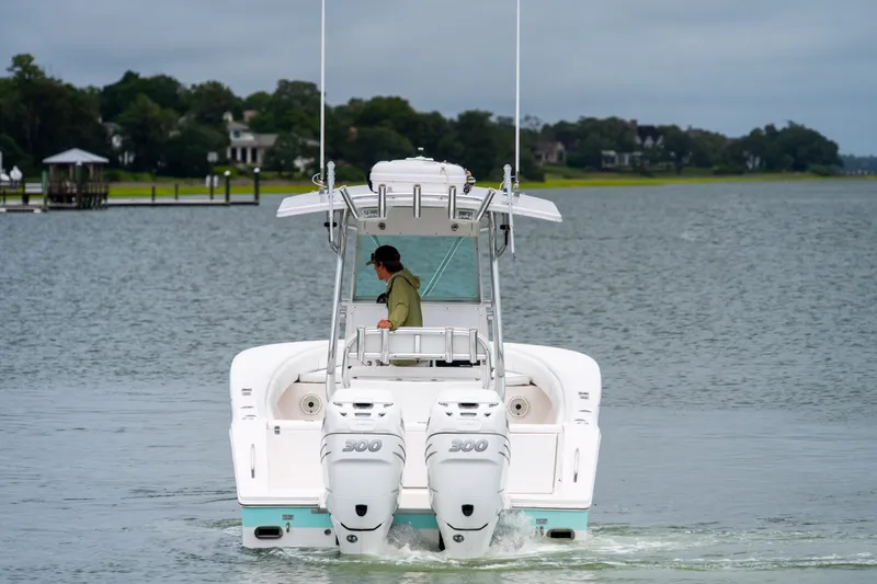 Slide: The Image of 2008 Regulator 29 Forward Seating boat cruising on a calm lake. - 12