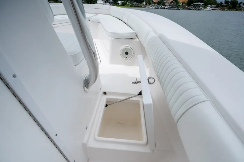 Slide: The Image of 2008 Regulator 29 Forward Seating boat interior with open storage compartment. - 34