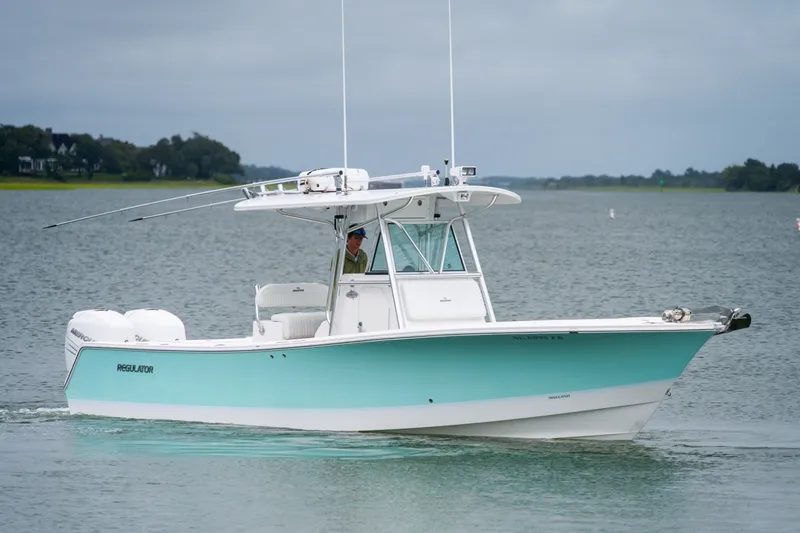 Slide: The Image of 2008 Regulator 29 Forward Seating boat cruising on a calm lake. - 3