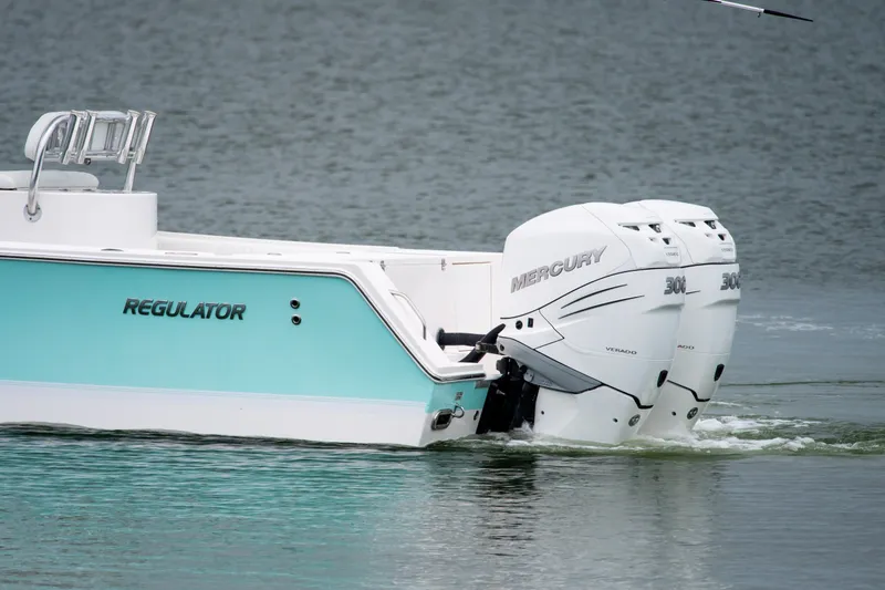 Slide: The Image of 2008 Regulator 29 Forward Seating boat with twin Mercury 300 engines on water. - 11