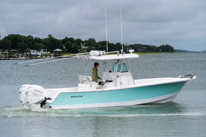 Slide: The Image of 2008 Regulator 29 Forward Seating boat cruising on a calm lake. - 4