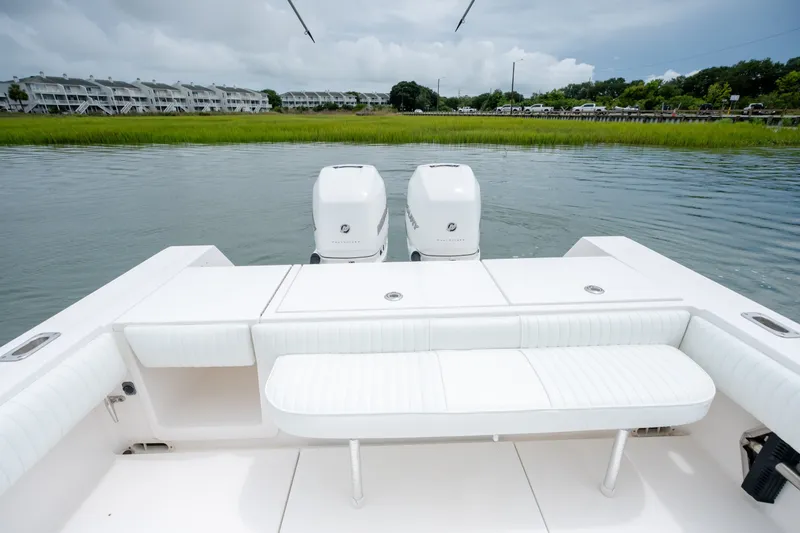 Slide: The Image of 2008 Regulator 29 Forward Seating boat with twin engines on calm water. - 14