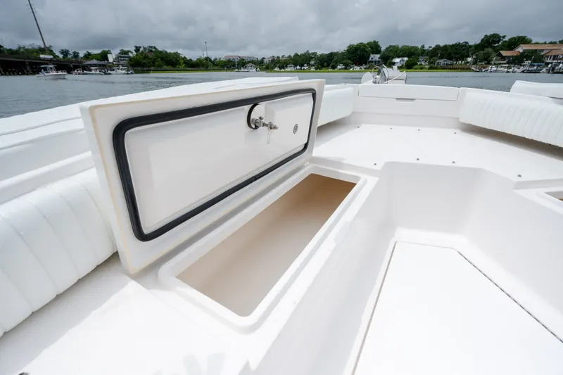 Slide: The Image of 2008 Regulator 29 Forward Seating boat with open storage compartment on deck. - 37