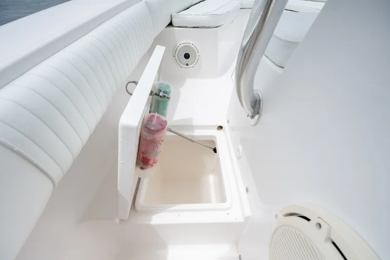 Slide: The Image of 2008 Regulator 29 Forward Seating boat interior with storage compartment and seating area. - 35