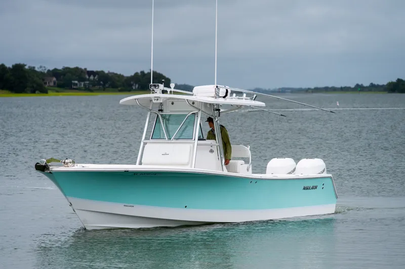 Slide: The Image of 2008 Regulator 29 Forward Seating boat on calm water, overcast sky. - 7