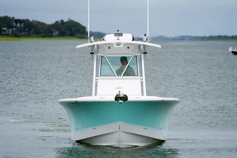 Slide: The Image of 2008 Regulator 29 Forward Seating boat cruising on calm waters. - 6