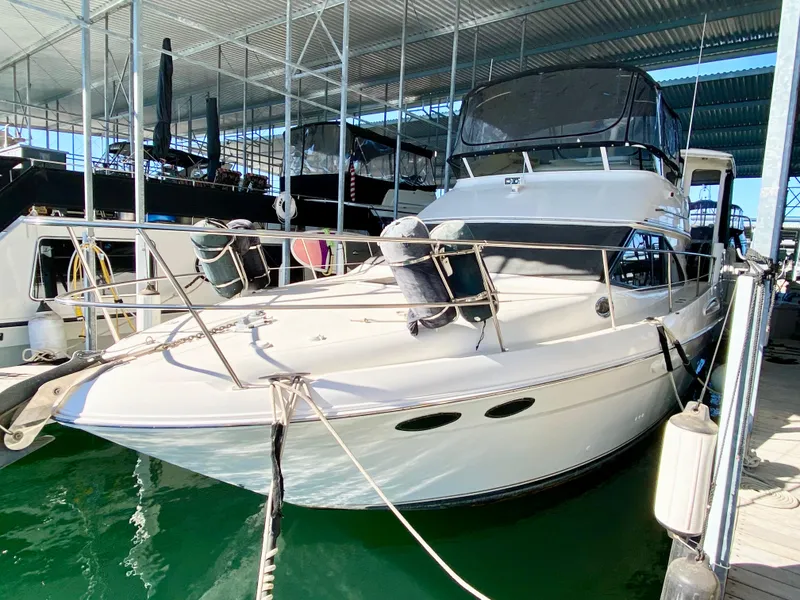 Slide: The Image of 2001 Sea Ray 380 Aft Cabin yacht docked in a marina. - 2