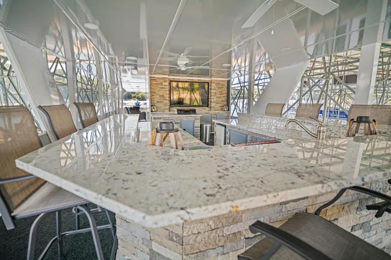 Slide: The Image of Luxurious 1999 Stardust Cruisers houseboat interior with modern bar and seating area. - 31