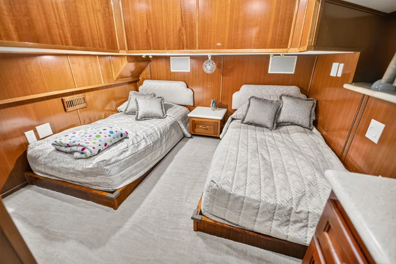 Slide: The Image of Luxurious twin bedroom in 1999 Stardust Cruisers houseboat, featuring elegant wood paneling. - 24