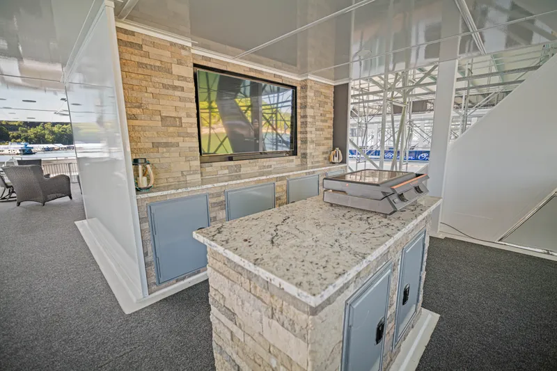 Slide: The Image of Luxurious 1999 Stardust Cruisers houseboat interior with modern kitchen and entertainment area. - 30