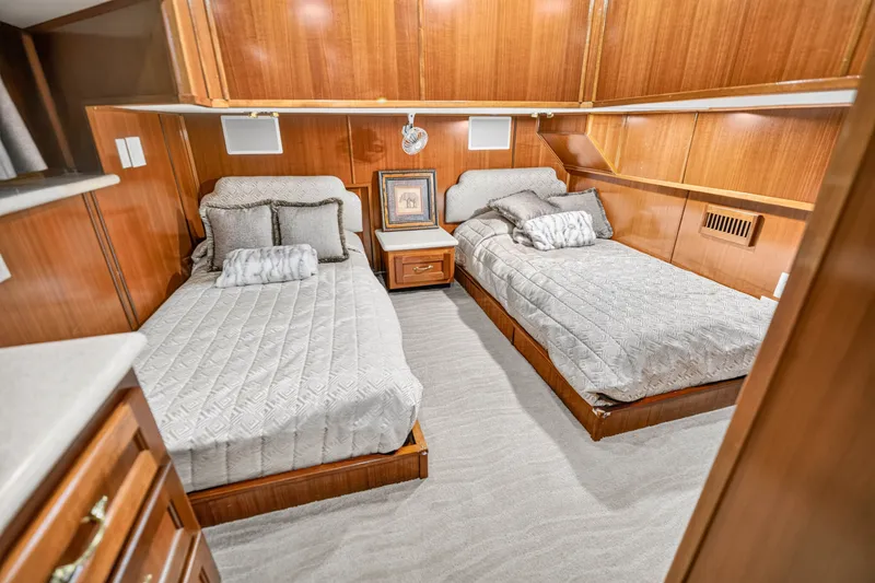 Slide: The Image of Luxurious twin bedroom in 1999 Stardust Cruisers houseboat, featuring elegant wood paneling and cozy bedding. - 21