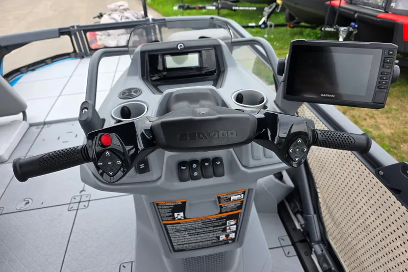 Slide: The Image of 2023 Sea-Doo Switch Sport 21 dashboard with steering controls and Garmin display. - 12