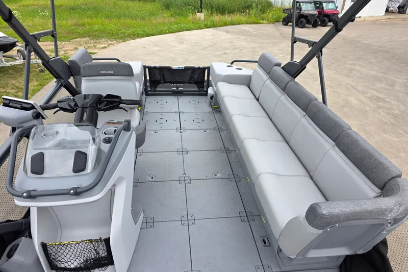 Slide: The Image of 2023 Sea-Doo Switch Sport 21 interior with spacious seating and modern controls. - 7