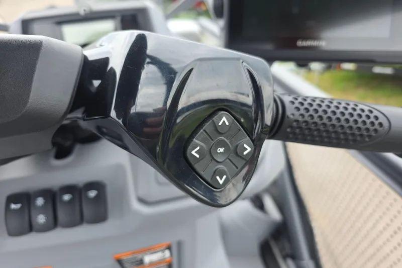 Slide: The Image of Close-up of 2023 Sea-Doo Switch Sport 21 handlebar controls with directional buttons. - 14