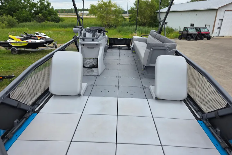 Slide: The Image of 2023 Sea-Doo Switch Sport 21 pontoon boat with spacious deck and seating. - 6