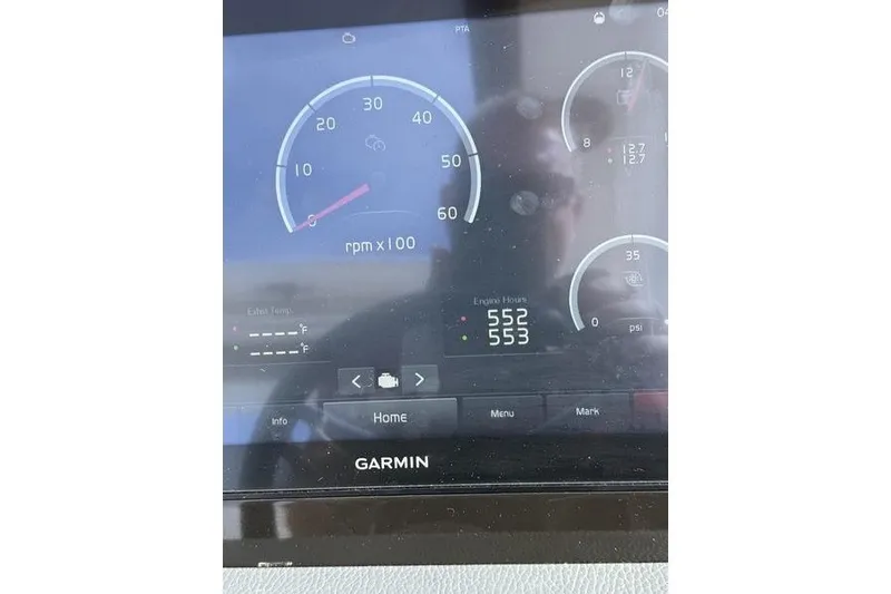 Slide: The Image of Garmin display showing engine RPM and hours on 2019 Regal 3300 Bowrider. - 27