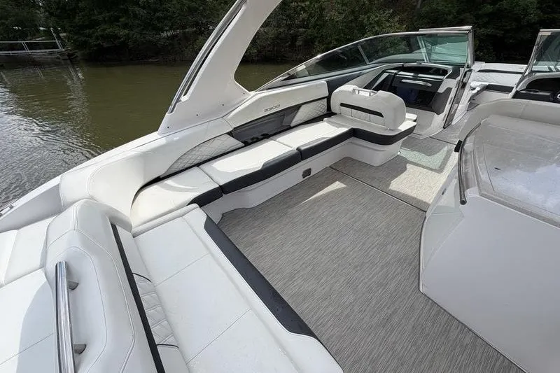 Slide: The Image of 2019 Regal 3300 Bowrider interior with spacious seating and modern design on a calm river. - 21