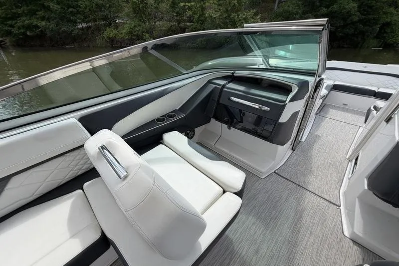 Slide: The Image of 2019 Regal 3300 Bowrider interior with sleek seating and modern dashboard design. - 20