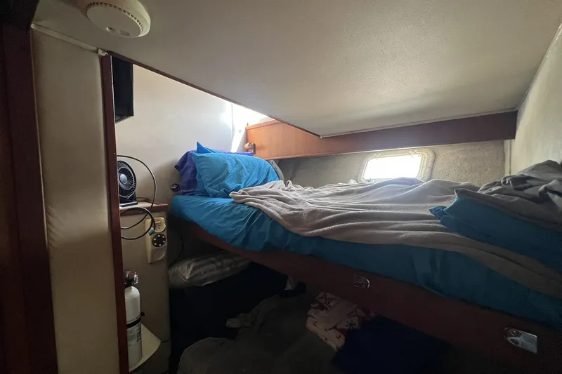 Slide: The Image of Cozy cabin interior of 1986 Chris Craft 47 Constellation with bunk bed and window. - 68