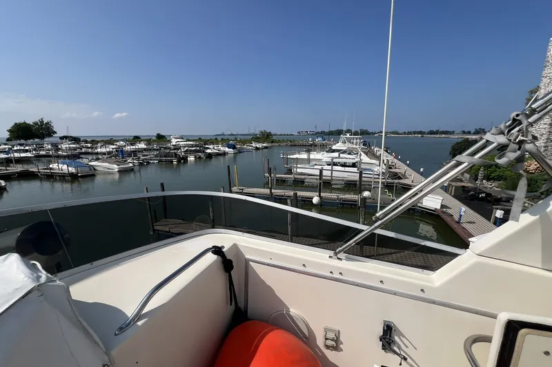 Slide: The Image of View from 1986 Chris Craft 47 Constellation yacht overlooking marina with docked boats. - 87