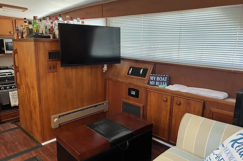 Slide: The Image of Interior of 1986 Chris Craft 47 Constellation yacht with wood paneling and modern amenities. - 37