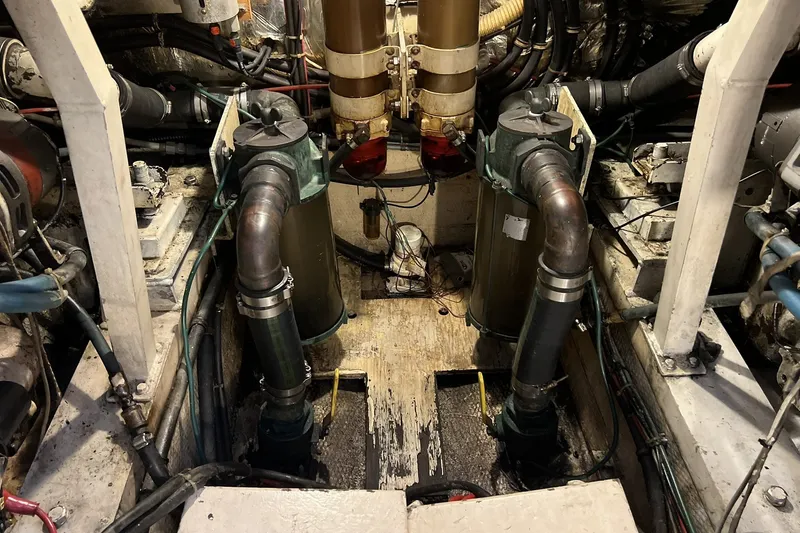 Slide: The Image of Engine room of a 1986 Chris Craft 47 Constellation yacht, showcasing mechanical components. - 97