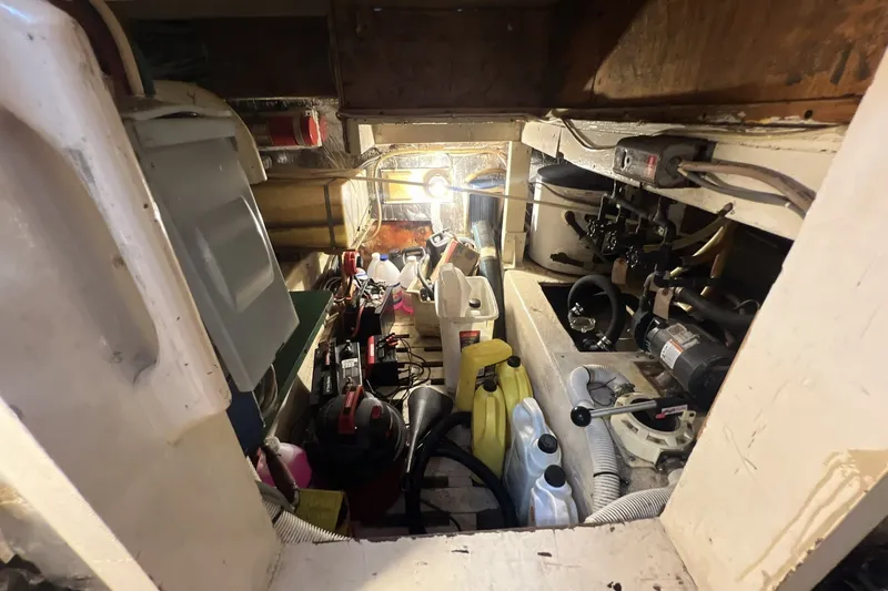 Slide: The Image of Engine room of a 1986 Chris Craft 47 Constellation, featuring various mechanical components. - 103
