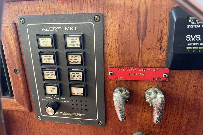 Slide: The Image of Control panel of a 1986 Chris Craft 47 Constellation boat with alert system and emergency shutdown. - 76