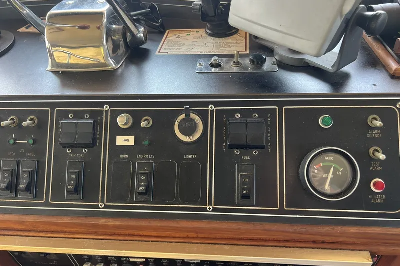 Slide: The Image of Control panel of a 1986 Chris Craft 47 Constellation boat. - 74