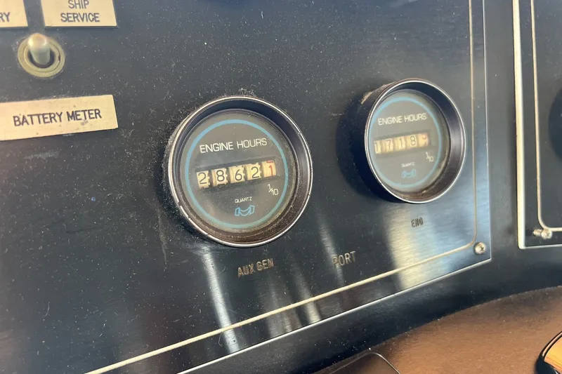 Slide: The Image of Close-up of engine hour meters on a 1986 Chris Craft 47 Constellation boat. - 107