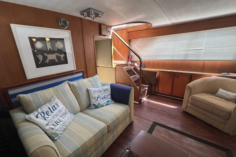 Slide: The Image of Interior of 1986 Chris Craft 47 Constellation yacht with cozy seating and nautical decor. - 35