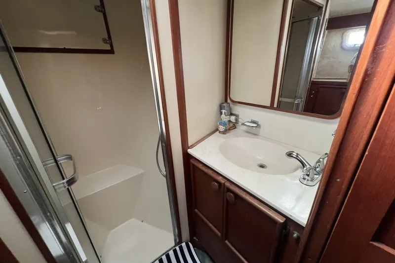 Slide: The Image of 1986 Chris Craft 47 Constellation yacht bathroom with shower and sink. - 61