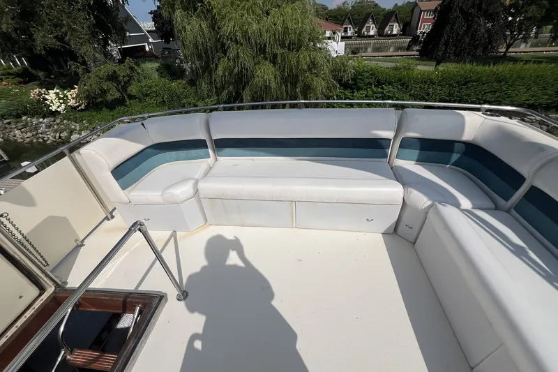Slide: The Image of 1986 Chris Craft 47 Constellation boat with spacious outdoor seating area. - 83