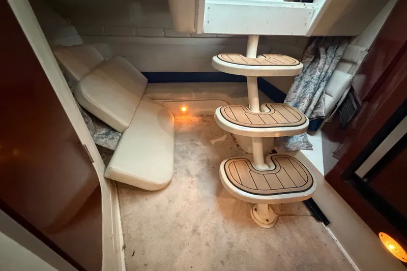 Slide: The Image of Interior cabin of 2000 Wellcraft 3300 Martinique with steps and seating area. - 23