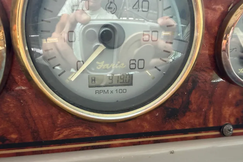 Slide: The Image of Close-up of a Wellcraft 3300 Martinique 2000 RPM gauge, showing 3190 RPM. - 17