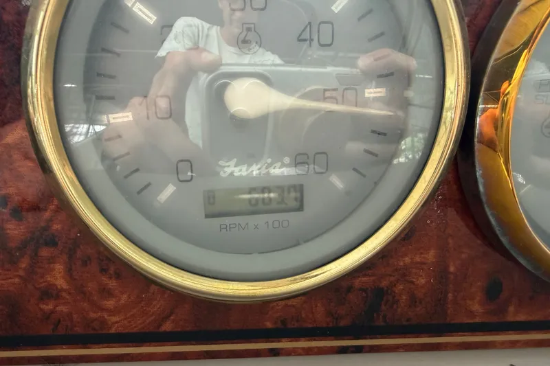 Slide: The Image of Close-up of a Wellcraft 3300 Martinique 2000 tachometer, showing RPM gauge details. - 18