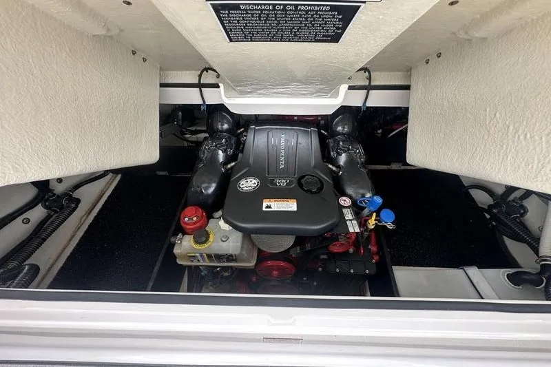 Slide: The Image of Engine compartment of a 2021 Regal 2800 Bowrider boat, showcasing the engine details. - 18