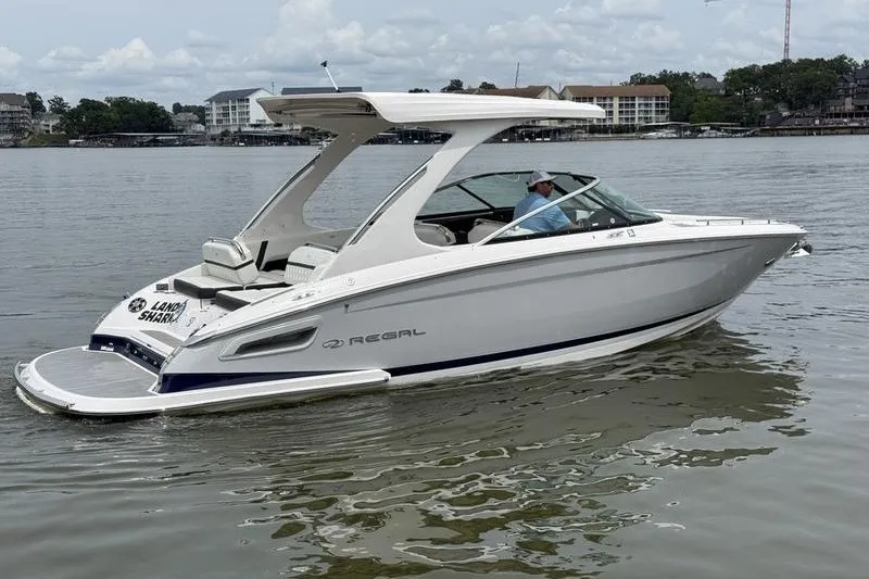 The Image of 2021 Regal 2800 Bowrider boat on calm water, featuring sleek design and modern amenities. - 1