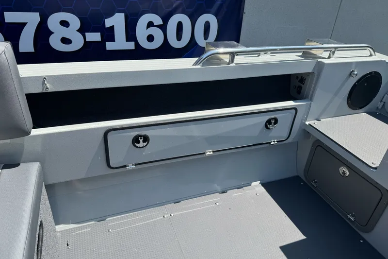 Slide: The Image of Interior view of a 2027 Duckworth 20 Discovery boat, featuring storage compartments. - 22