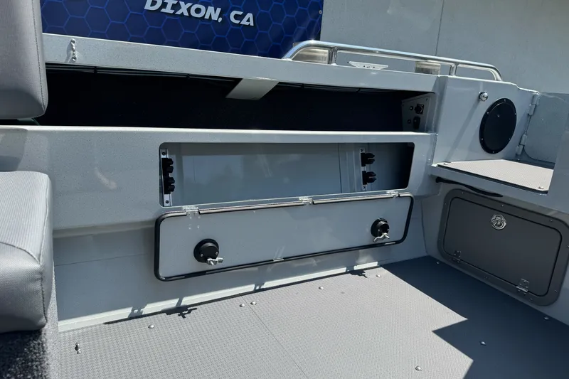 Slide: The Image of Interior of a 2027 Duckworth 20 Discovery boat, showcasing storage compartments. - 23