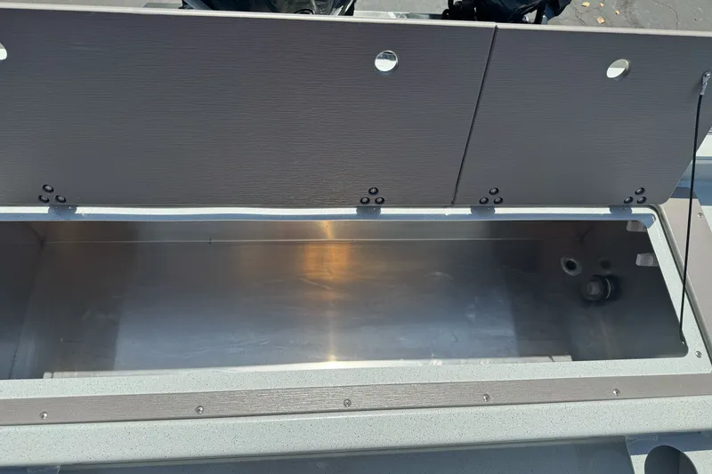 Slide: The Image of Open storage compartment on a 2027 Duckworth 20 Discovery boat, showcasing interior space. - 26