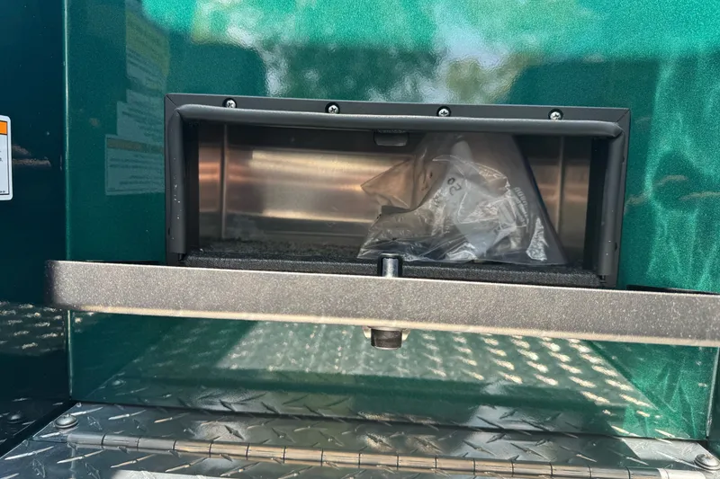 Slide: The Image of Storage compartment on a 2027 Duckworth 20 Discovery boat, featuring a metallic finish. - 15