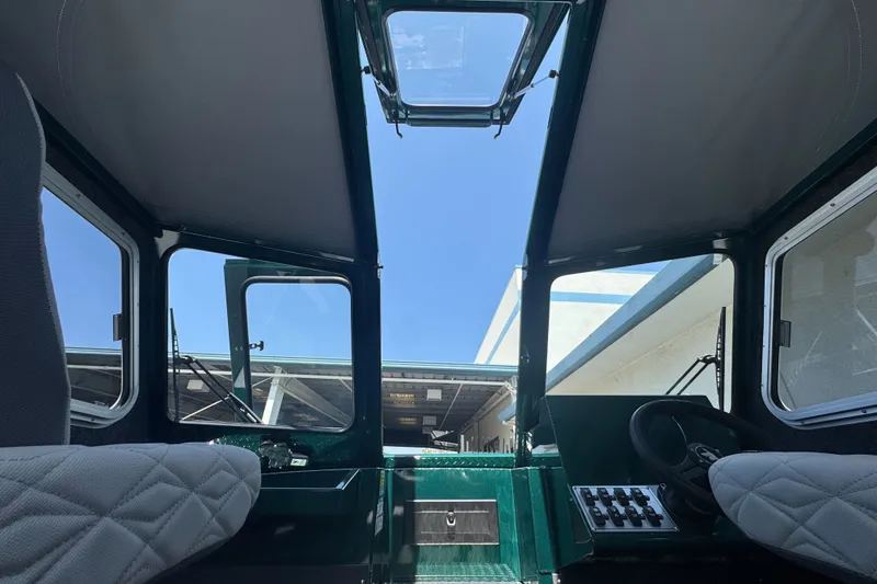 Slide: The Image of Interior view of 2027 Duckworth 20 Discovery boat cockpit with open roof hatch. - 20