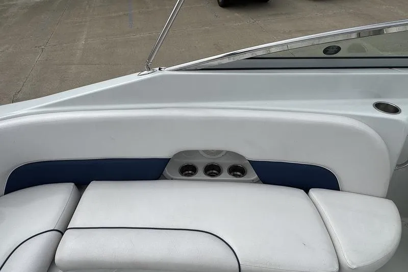 Slide: The Image of 2014 Crownline 275 SS boat interior with white and blue seating. - 14