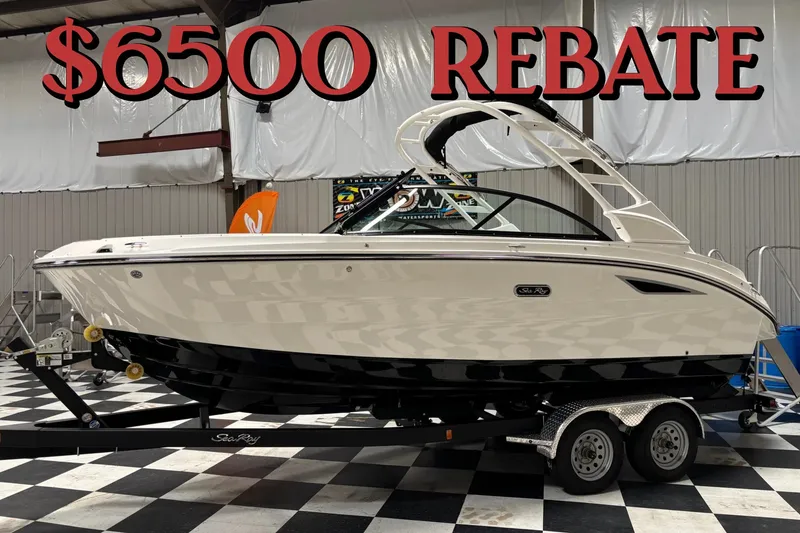 The Image of 2026 Sea Ray SDX 230 boat with $6500 rebate offer in showroom. - 0