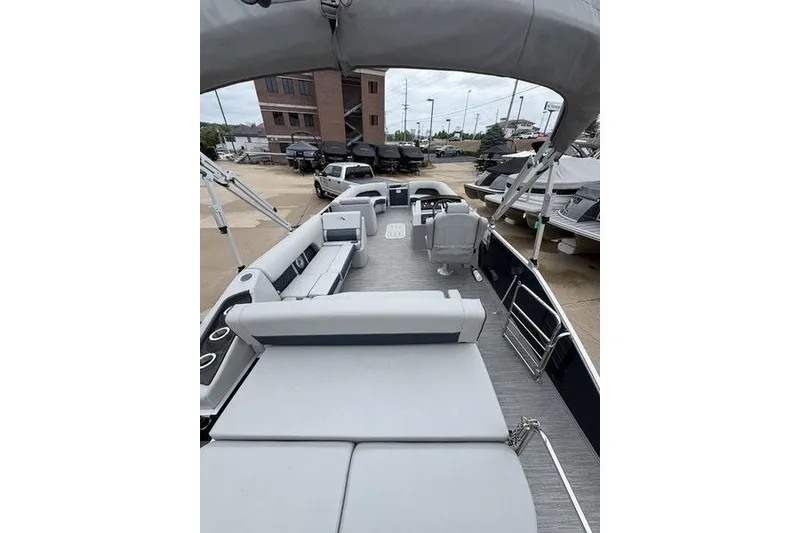 Slide: The Image of 2023 Bennington 25 LSB pontoon boat with spacious seating and modern design. - 15