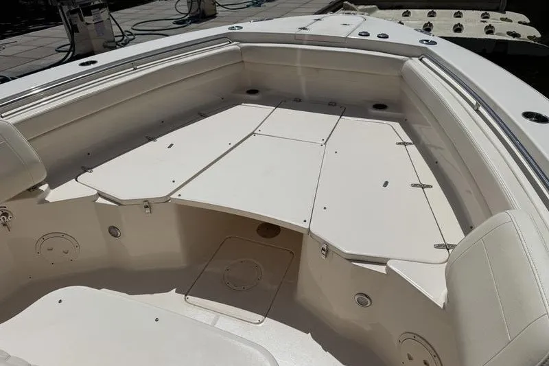 Slide: The Image of 2024 Grady-White Canyon 306 boat interior with spacious seating and storage. - 10