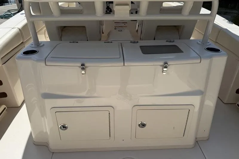 Slide: The Image of 2024 Grady-White Canyon 306 boat interior with storage compartments and seating. - 21