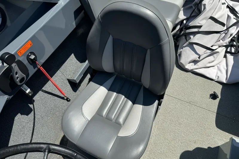 Slide: The Image of 2021 Hewescraft 180 River Runner boat seat with gray upholstery and control panel. - 8