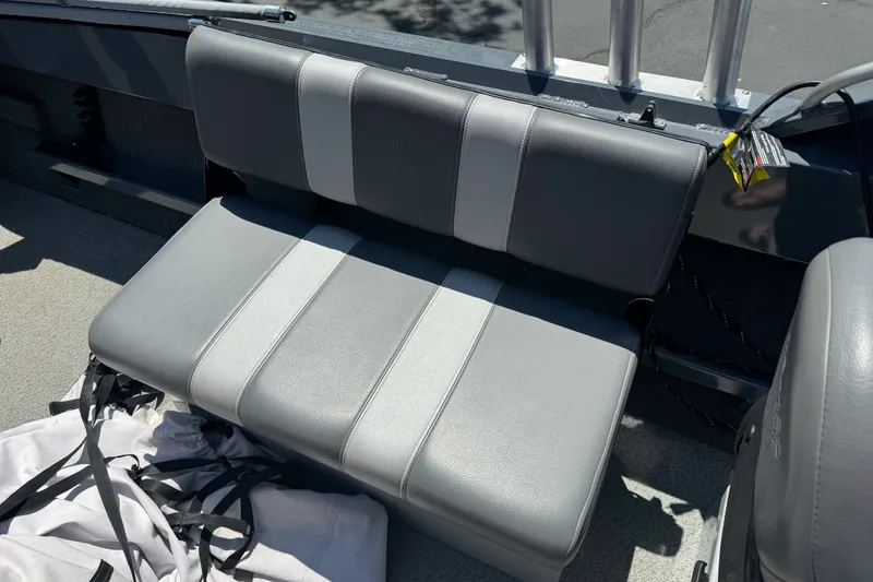 Slide: The Image of Gray seating on 2021 Hewescraft 180 River Runner boat, with rod holders and storage. - 14